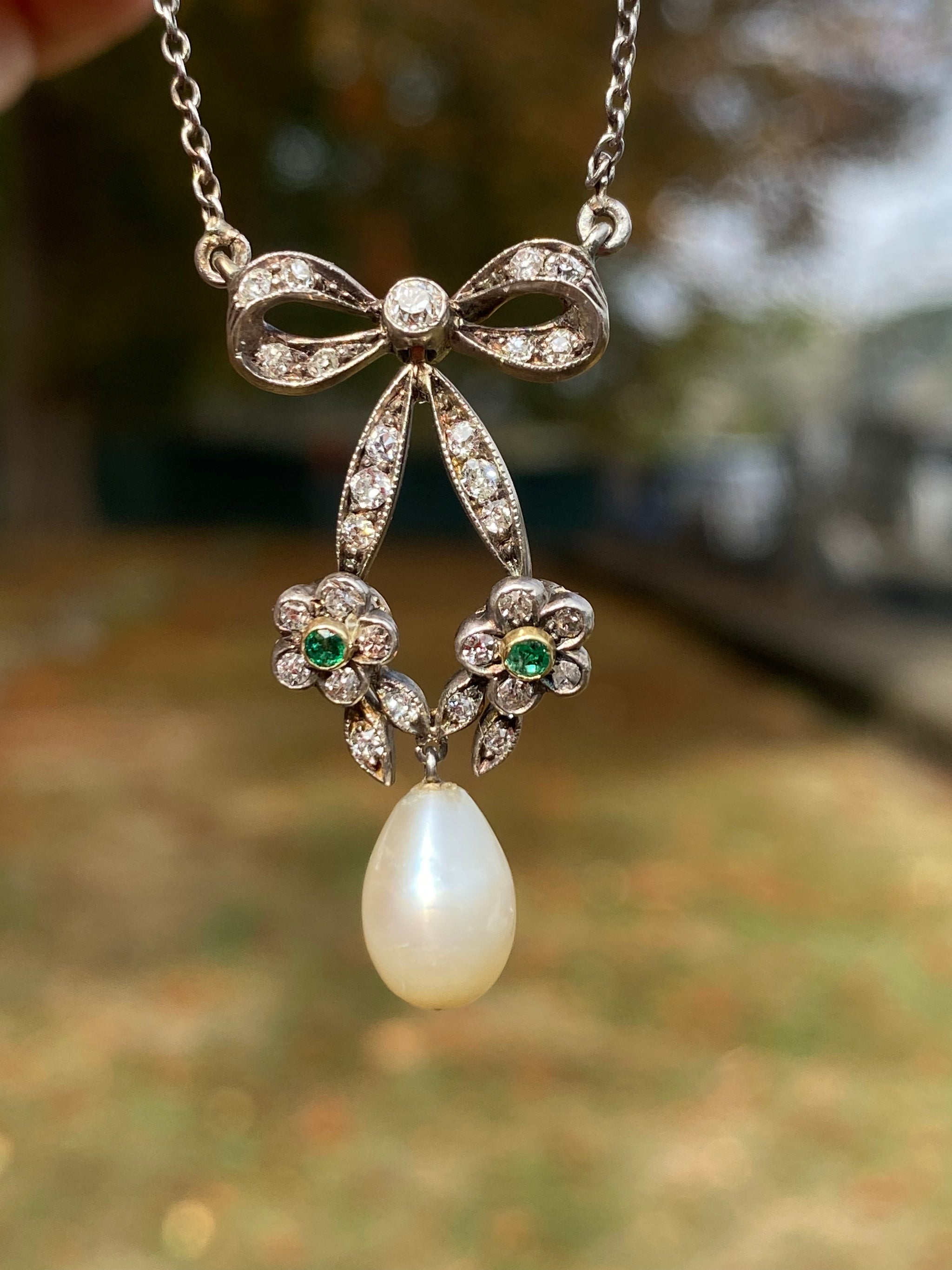 Edwardian 18K White Gold & Platinum Natural Saltwater Pearl, Emerald & Diamond Bow Necklace | GCS Certified | c.1900–1910