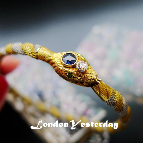 MID OF 20TH 18CT YELLOW GOLD PLATINUM NATURAL SAPPHIRE SNAKE BANGLE